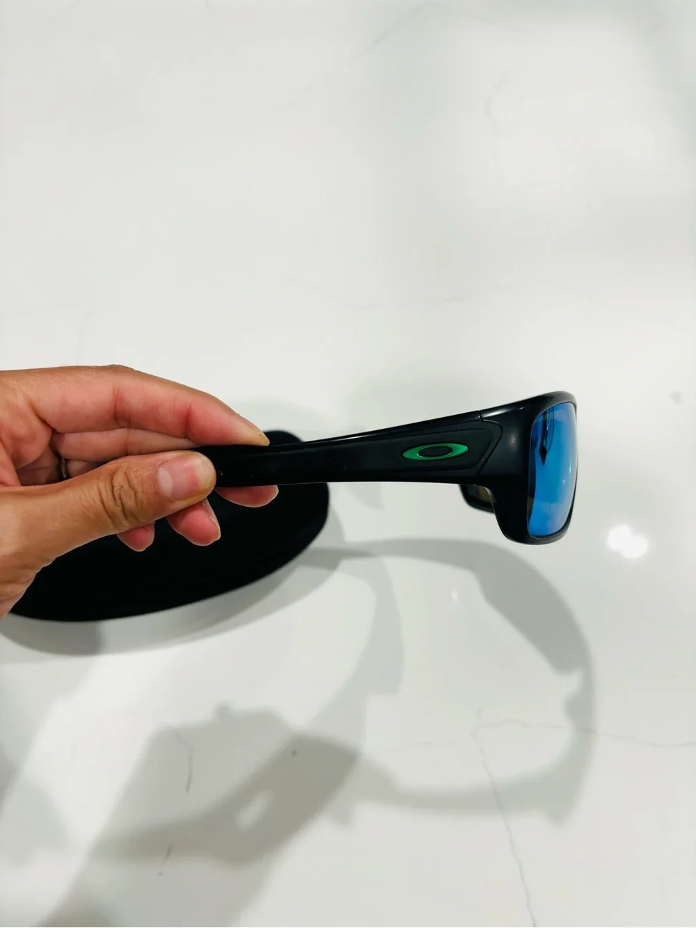 Oakley Black Frame Sunglasses with Green-Blue Mirrored Lenses